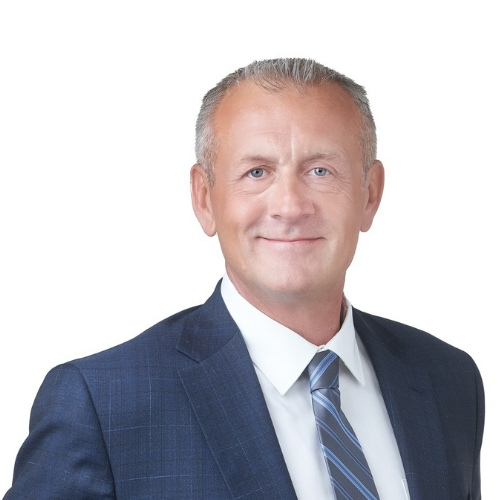man smiling in front of a white background