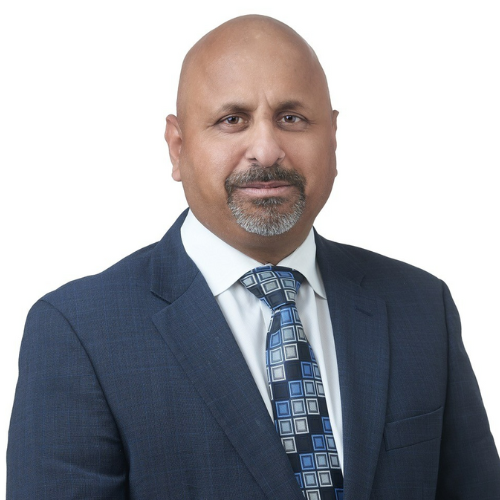 man smiling in front of a white background
